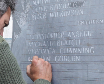 marking out the letters in white chinagraph pencil on the prepared welsh slate